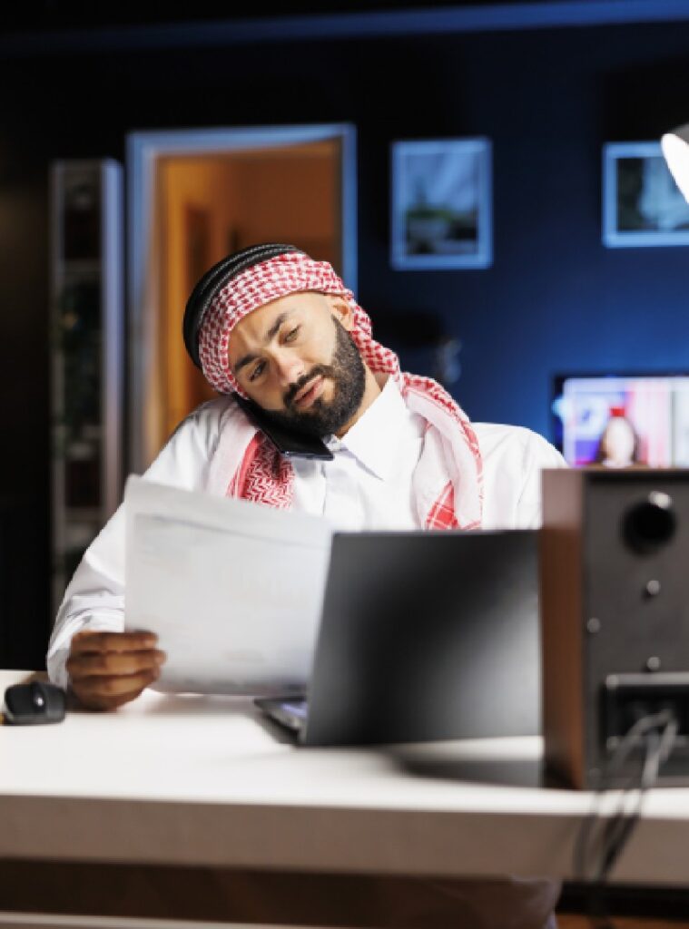 Arab man reviewing LUDIATE company document attentively