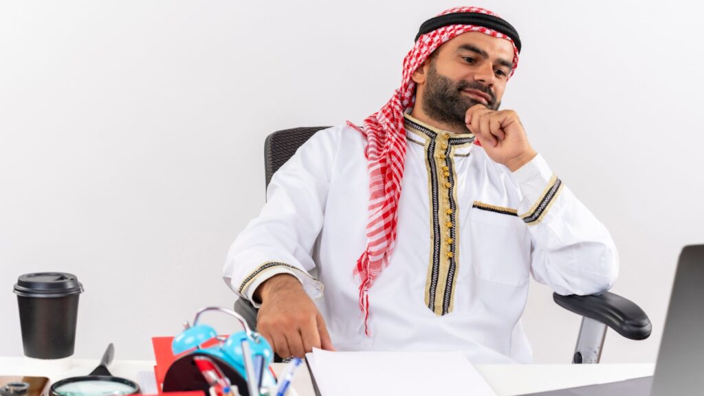 Thoughtful Arab Businessman Planning Strategy at Work, Cancel Your Trade License in Dubai.