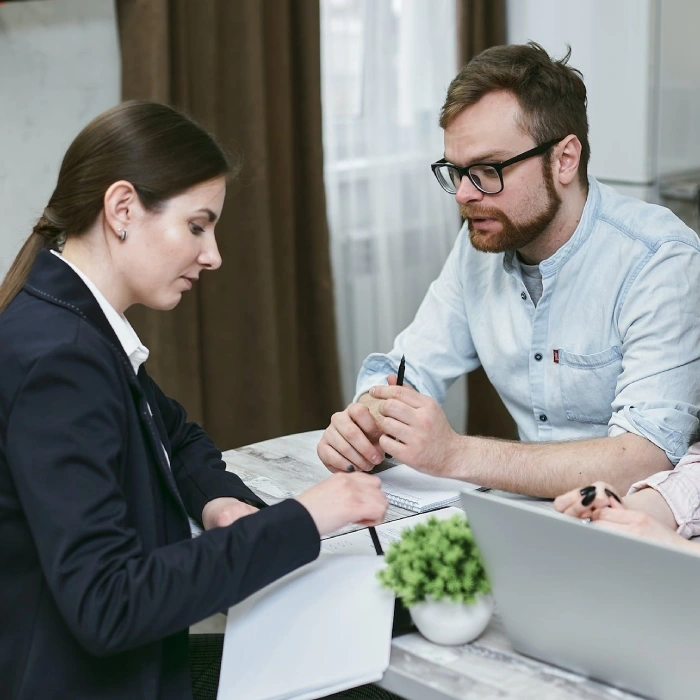 Home 7 Business professionals discussing documents in office